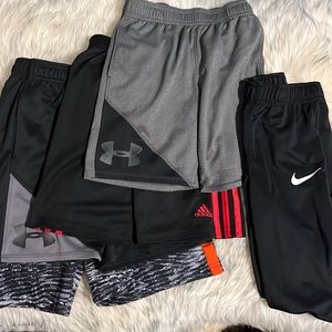 Boys size 6/7 brand name shorts (4) and Nike pants (1).